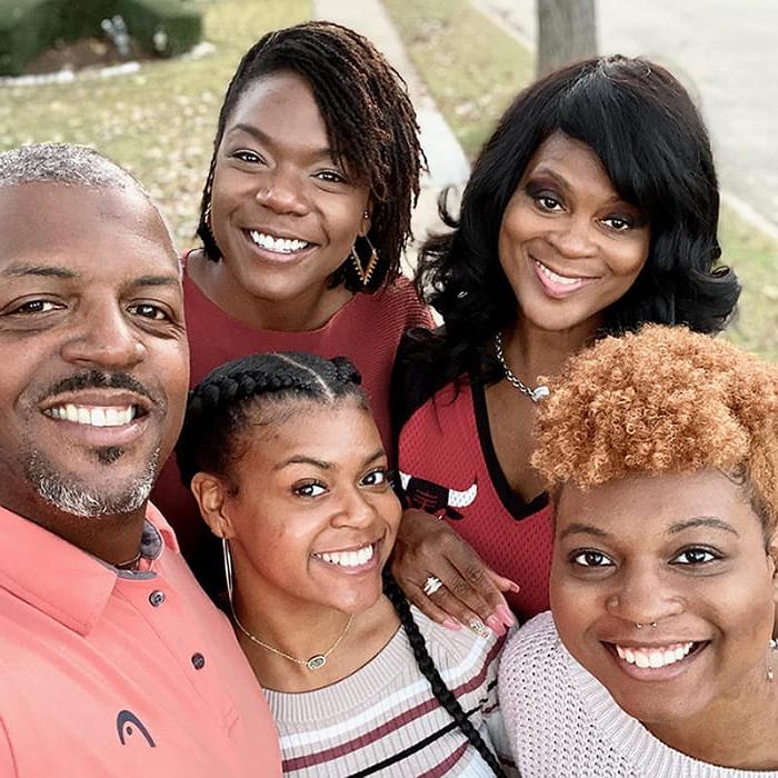 Darryl Griffin and four family members posing together outside for a selfie
